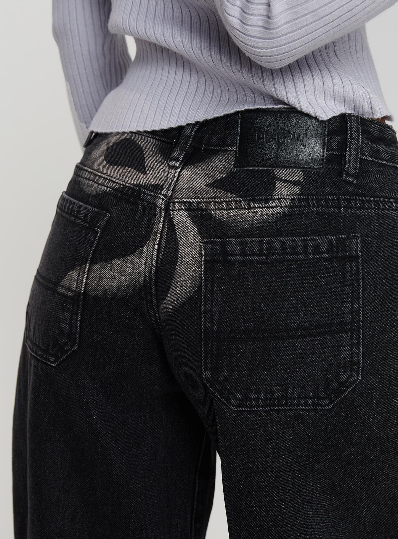 side view of model wearing Princess Polly Ribbon Stamp Wide Leg Jeans Washed Black Low Rise Jeans 