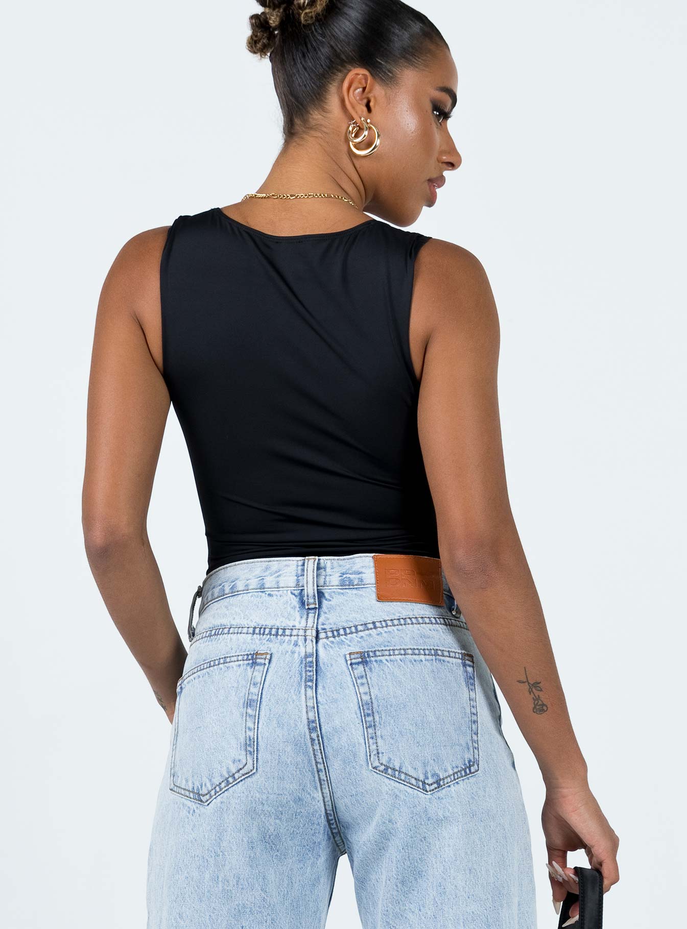 back view of model wearing Princess Polly Zoe Bodysuit Black Sleeveless Scoop Neck 