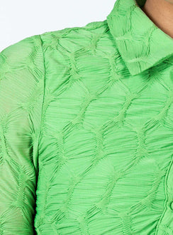 Front view of model wearing  front Princess Polly V-Neck  Calvert Long Sleeve Mini Dress Green