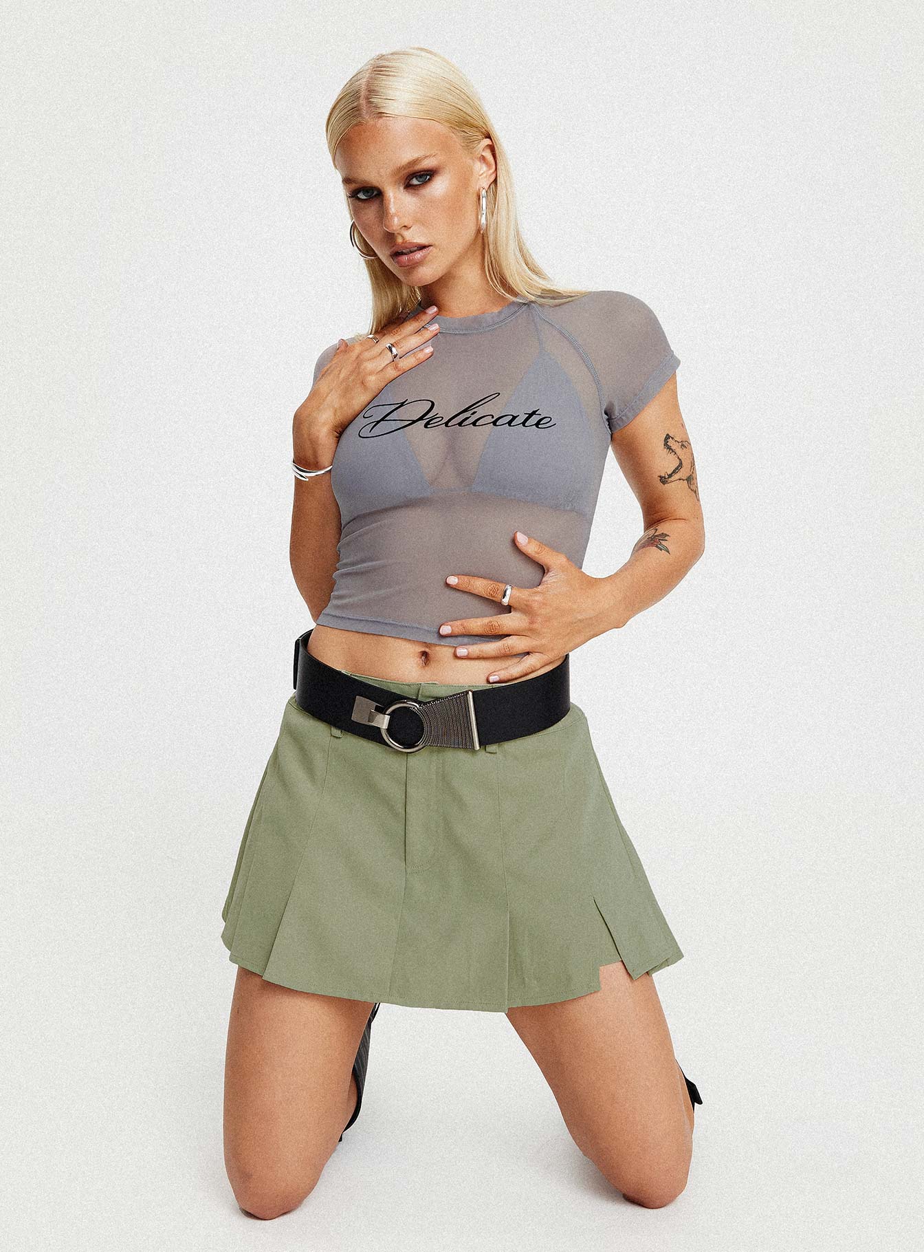 Green Mini skort Belt looped waist zip and button front fastening pleated hem built in shorts