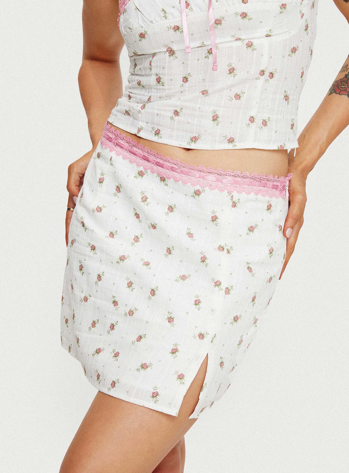 Pink and white floral mini skirt