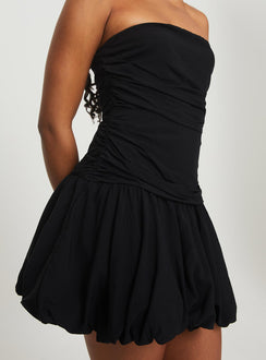 back view of model wearing Princess Polly Glamour Girl Strapless Bubble Hem Mini Dress Black Straight Neck 