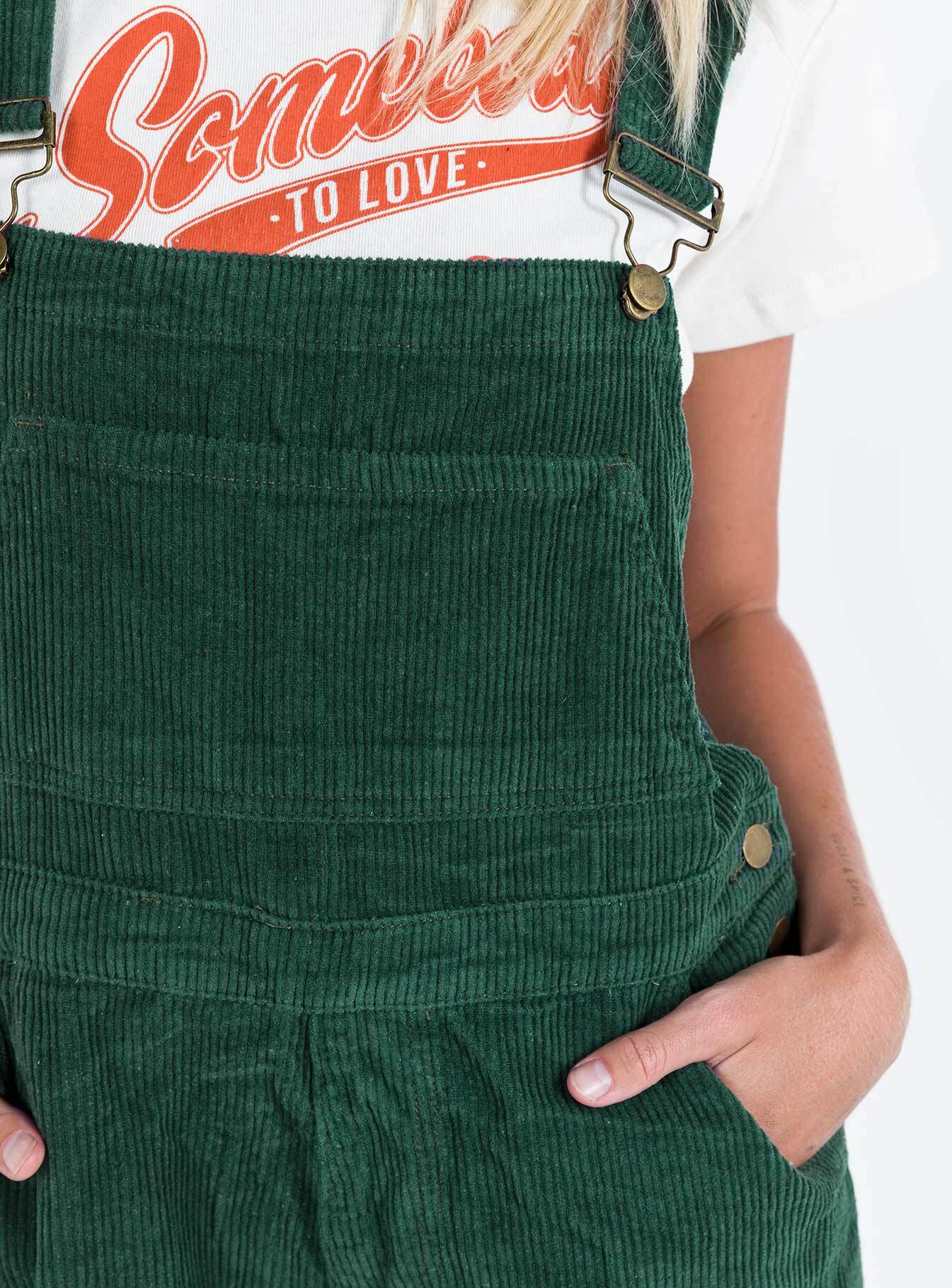 Khaki overalls Cord material  Adjustable shoulder straps  Button fastening at hips  Chest pocket 