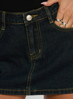   side view of model wearing Princess Polly Electric Star Patch Pocket Mini Skirt Dark Blue Wash Mini Skirts 