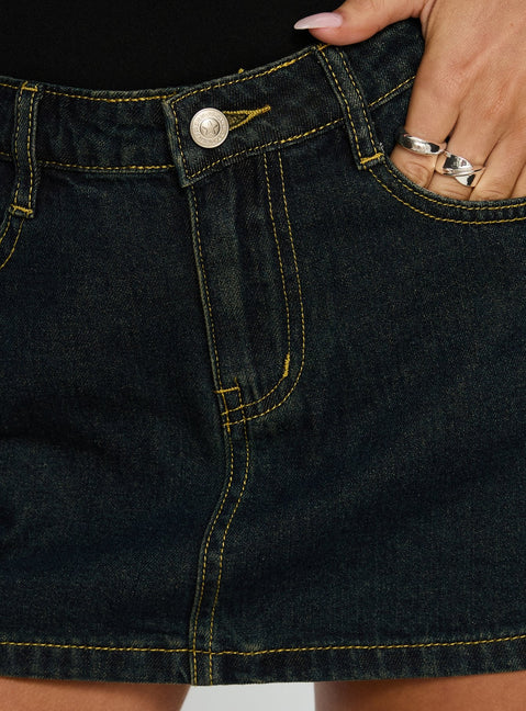   side view of model wearing Princess Polly Electric Star Patch Pocket Mini Skirt Dark Blue Wash Mini Skirts Skirts 