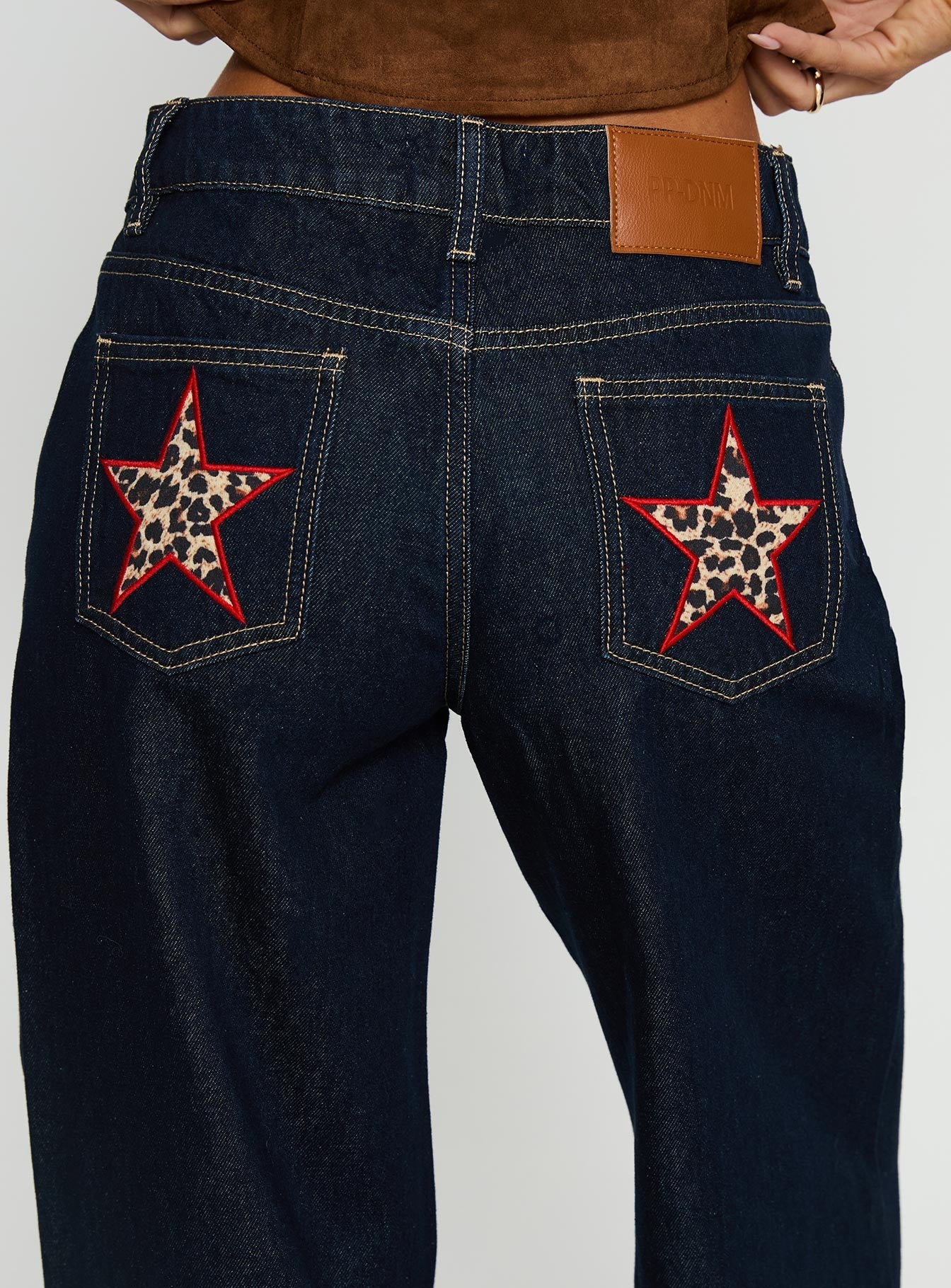 side view of model wearing Princess Polly Favourite Reference Mid Rise Straight Leg Jeans Dark Indigo Mid Rise Jeans 