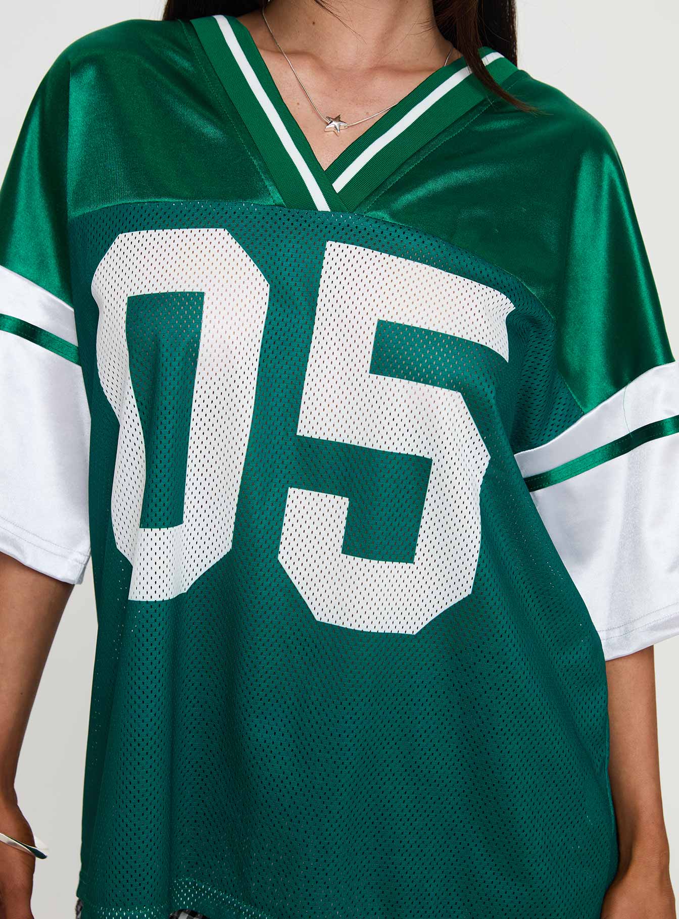 back view of model wearing Princess Polly Kronwall Sports Jersey Top Green / White Three Fourth Sleeves V-Neck 