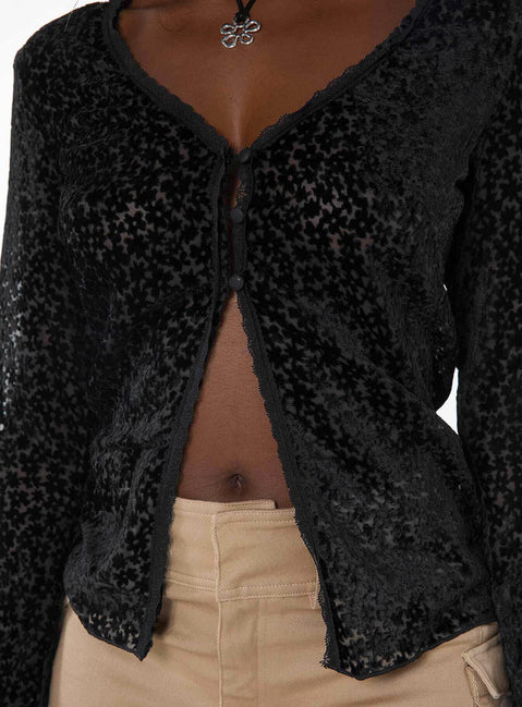 Long sleeve top, v-neckline Button fastening at front, split hem, lace trim