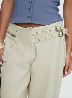 back view of model wearing Princess Polly Paltrow Mid Rise Wide Leg Cargo Jeans Cream Petite Low Rise Jeans 