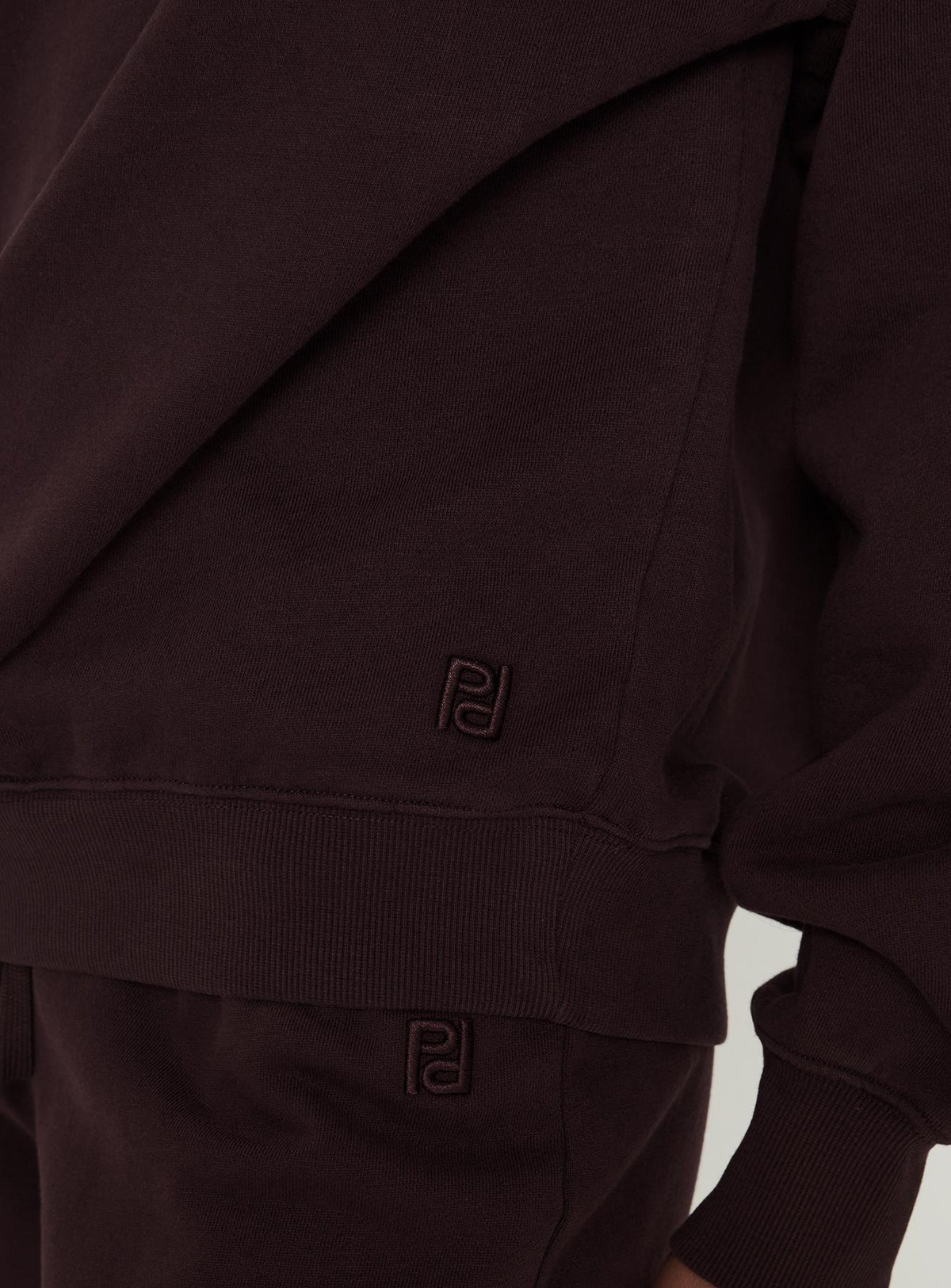 Highlighting the Wellness Off The Shoulder Jumper Brown in women's jumpers with off shoulder detail Princess Polly