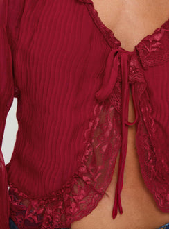 Long sleeve top Plunging neckline, lace trim, tie fastening at bust, elasticated wrists, sheer sleeves Non-stretch, lined bust