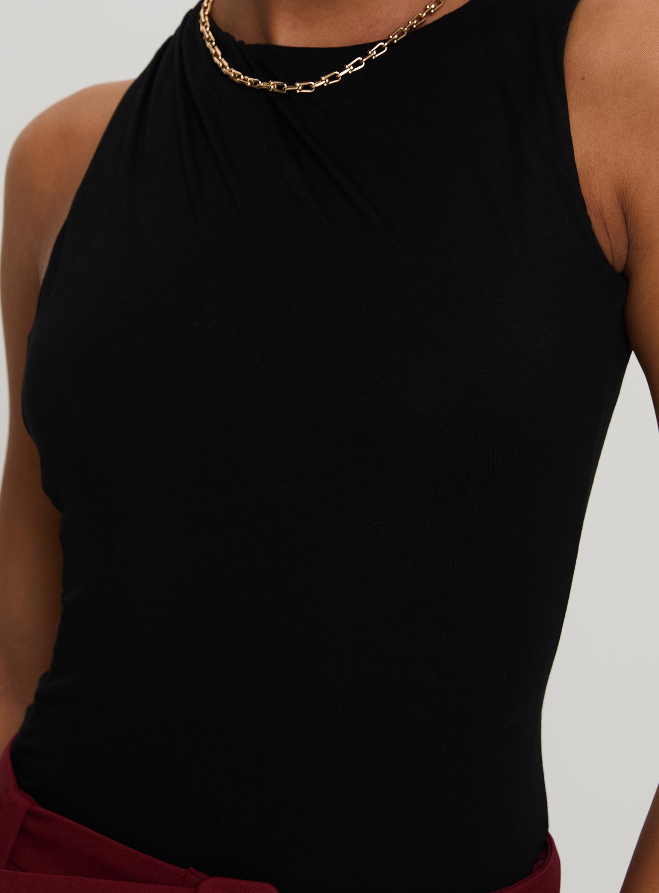 front view of model wearing Princess Polly Centre Stage Cut Out Bodysuit Black Sleeveless 