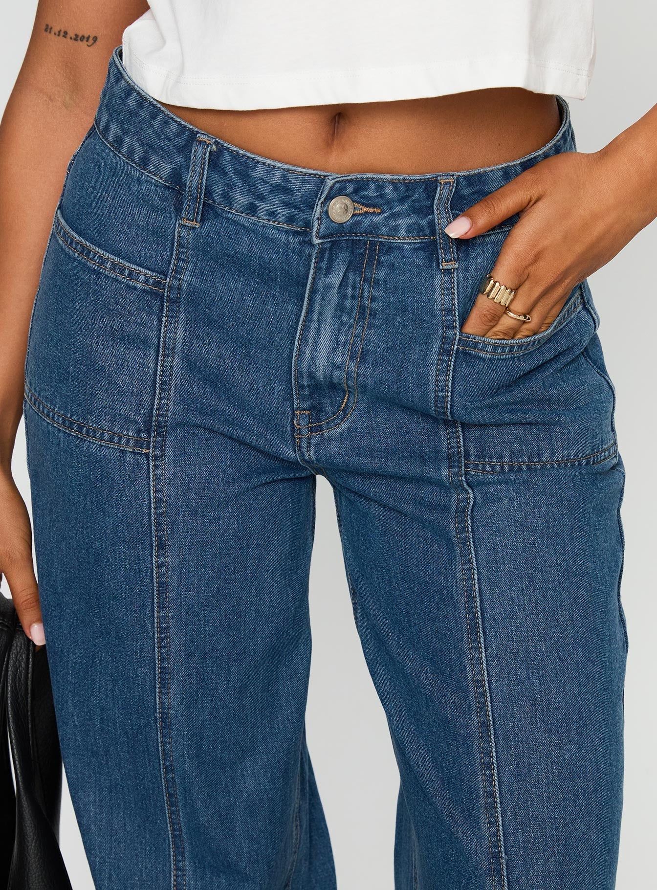 front view of model wearing Princess Polly Taji Wide Leg Jeans Dark Blue Mid Rise 