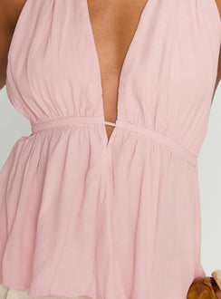 back view of model wearing Princess Polly Saddler Halter Top Pink Sleeveless Plunger 