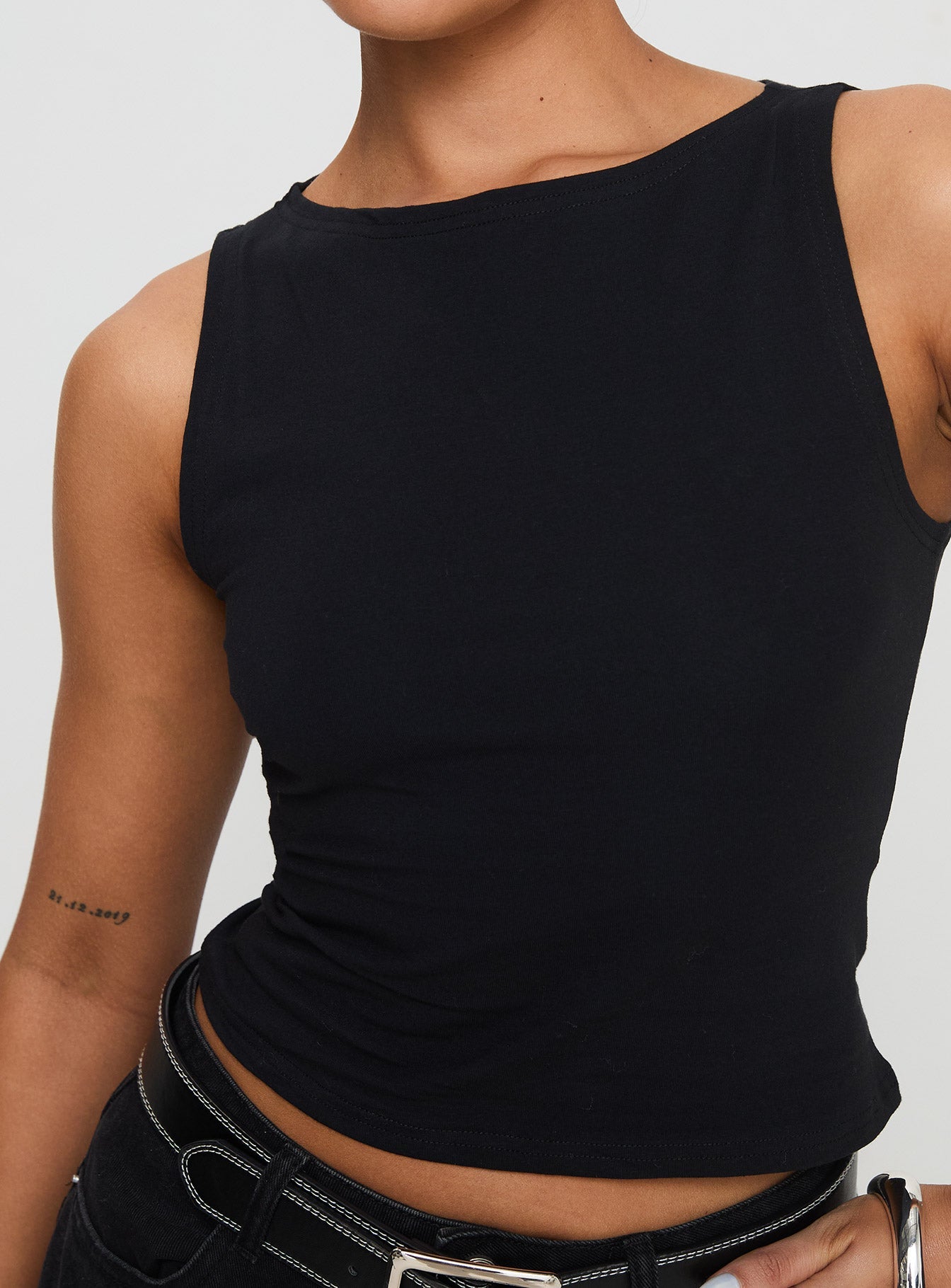 back view of model wearing Princess Polly Bleeker High Neck Top Black Sleeveless Boat Neck 