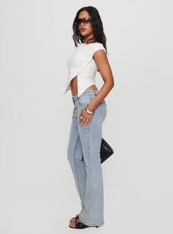 side view of model wearing Princess Polly Bethany Bootleg Low Rise Jeans Light Wash Low Rise Jeans 