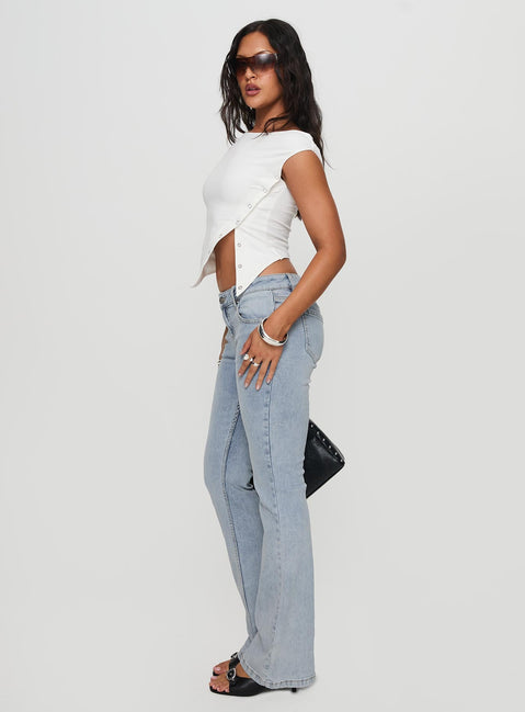 side view of model wearing Princess Polly Bethany Bootleg Low Rise Jeans Light Wash Low Rise Jeans 