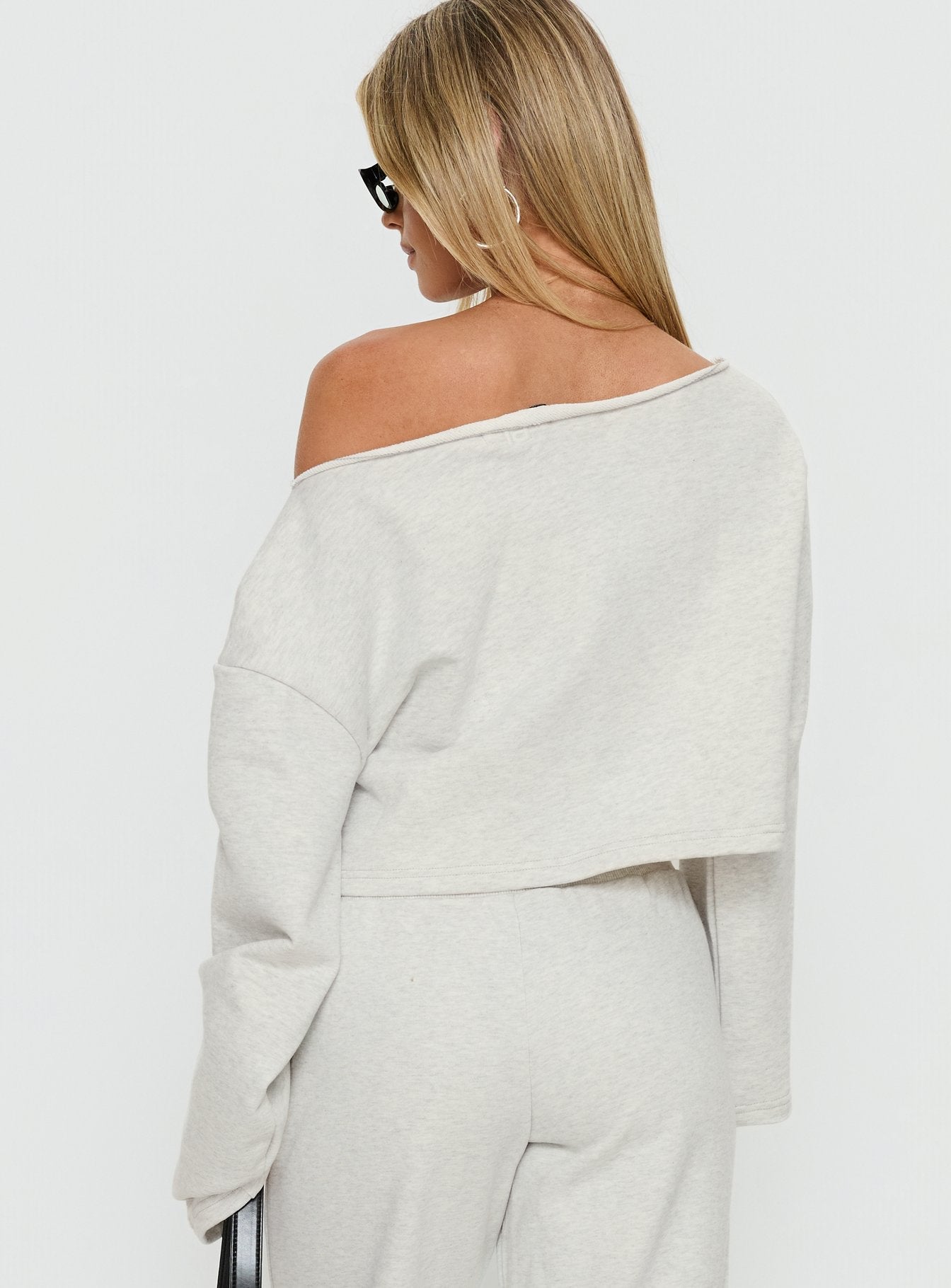 back view of model wearing Princess Polly Retreat Raw Edge Off Shoulder Jumper Snow Marle cropped 