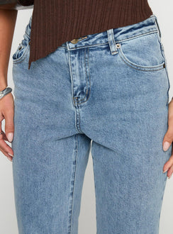 side view of model wearing Princess Polly Magic Mirror Mid Rise Bootleg Jeans Ice Wash Tall Mid Rise Jeans 