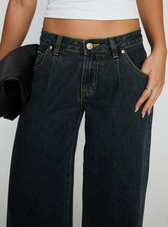 side view of model wearing Princess Polly Supercut Low Rise Baggy Pleat Jeans Grunge Wash Low Rise Jeans 