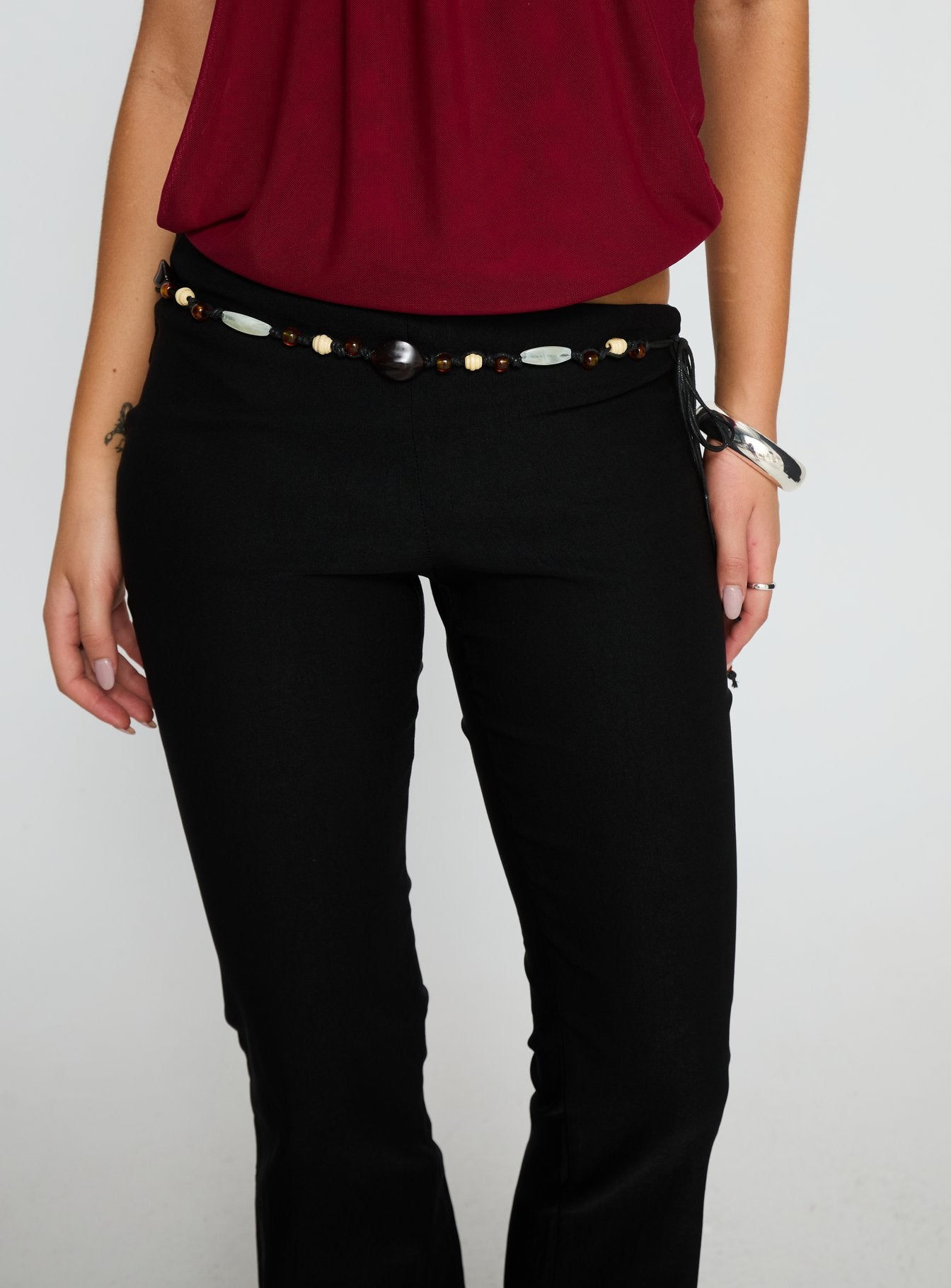 front view of model wearing Princess Polly Krislynn Button Belt Pants Black Mid Rise Pants 