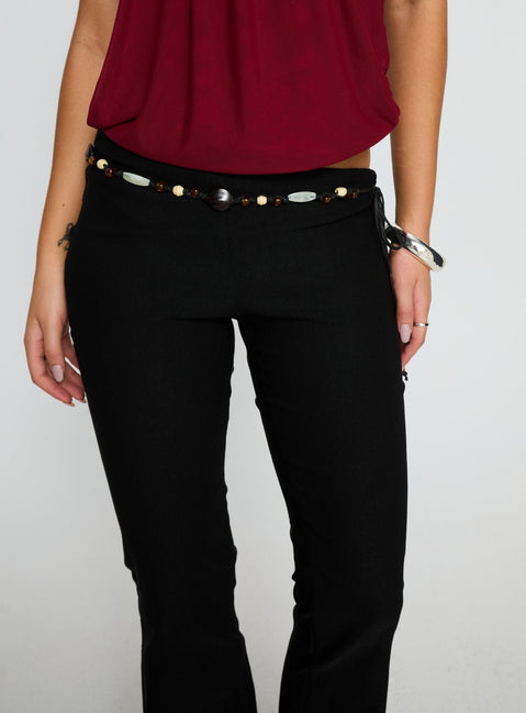 front view of model wearing Princess Polly Krislynn Button Belt Pants Black Mid Rise Pants 