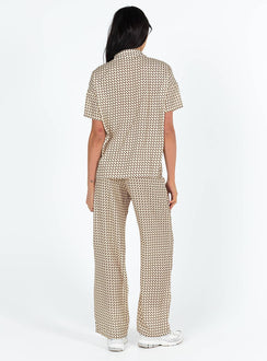 Matching set Geo print Short sleeve shirt Classic collar Button fastening at front Drop shoulder Twin front pockets Pants Elasticated waistband Twin hip pockets Wide leg 