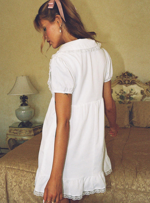 back view of model wearing Princess Polly Penelofie Mini Dress White V-Neck 