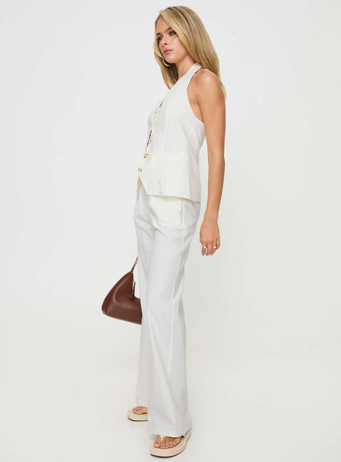 White Matching linen set Halter neck top, fixed halter strap, button fastening at front, twin hip pockets High rise pants, belt looped waist, zip and button fastening, elasticated waistband at back, twin hip pockets, straight leg