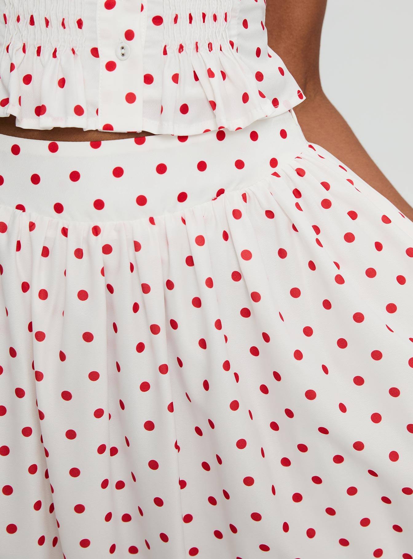   side view of model wearing Princess Polly Valerio Maxi Skirt White / Red Maxi 