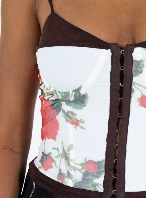 Front view of model wearing  front Princess Polly Sleeveless Asymmetric Neckline  Colton Corset Top White Floral