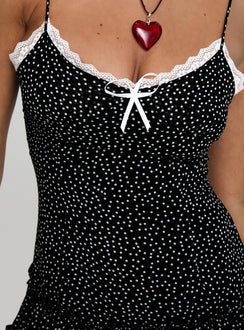 back view of model wearing Princess Polly Yves Mini Dress Onyx Polka Scoop Neck 