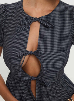 back view of model wearing Princess Polly Verah Tie Up Puff Sleeve Top Navy Check Short Sleeves Scoop Neck 