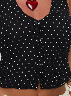 back view of model wearing Princess Polly Brat Halter Top Onyx Polka Sleeveless V-Neck 