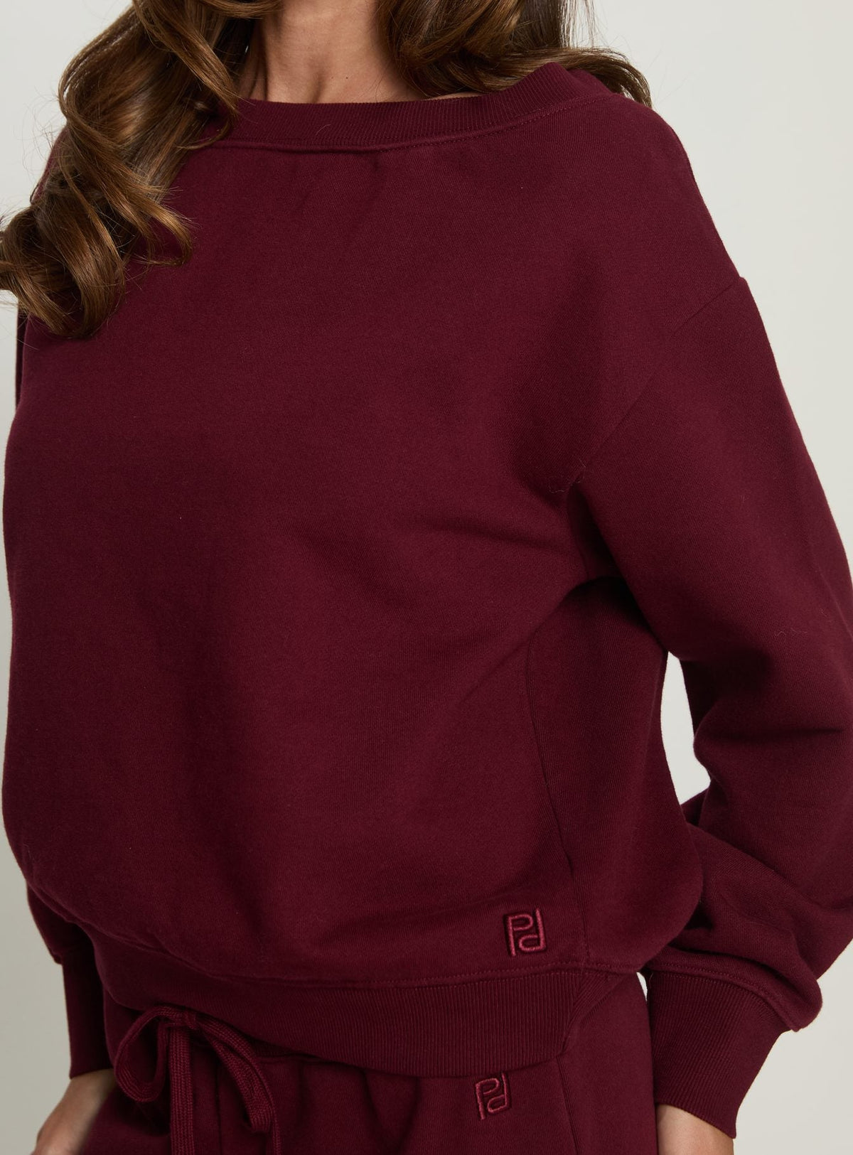 back view of model wearing Princess Polly Wellness Off the Shoulder Jumper Currant cropped Jumpers 