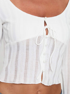 Long sleeve top Scooped neckline, knit material, button fastening at front, tie detail Good stretch, lined bust