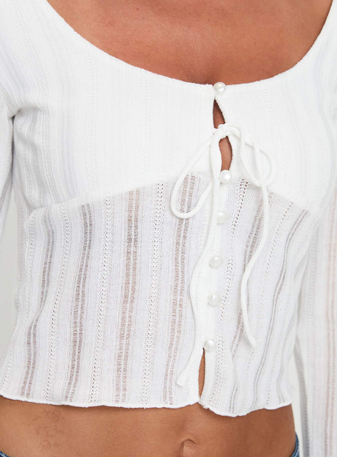 Long sleeve top Scooped neckline, knit material, button fastening at front, tie detail Good stretch, lined bust