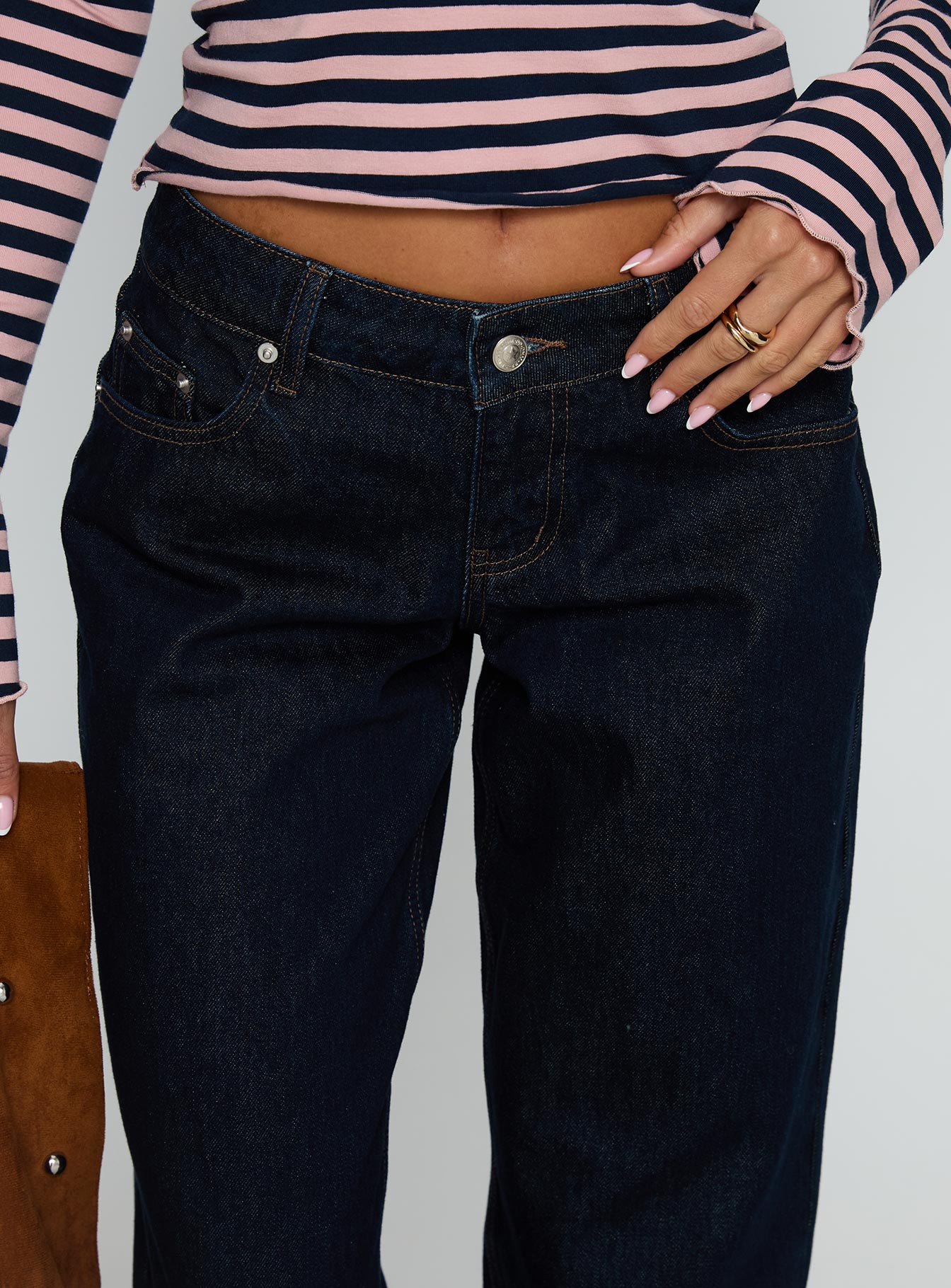 side view of model wearing Princess Polly Ellanor Low Rise Straight Leg Jeans Indigo Blue Low Rise Jeans 