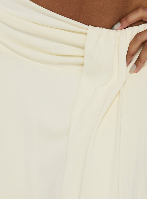 Highlighting the Iselda Draped Midi Skirt Cream in womens-skirts with elasticated waistband detail Princess Polly