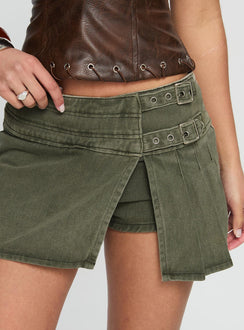 back view of model wearing Princess Polly Generous Wrap Buckle Skort Washed Khaki Mini Skirts Skirts 