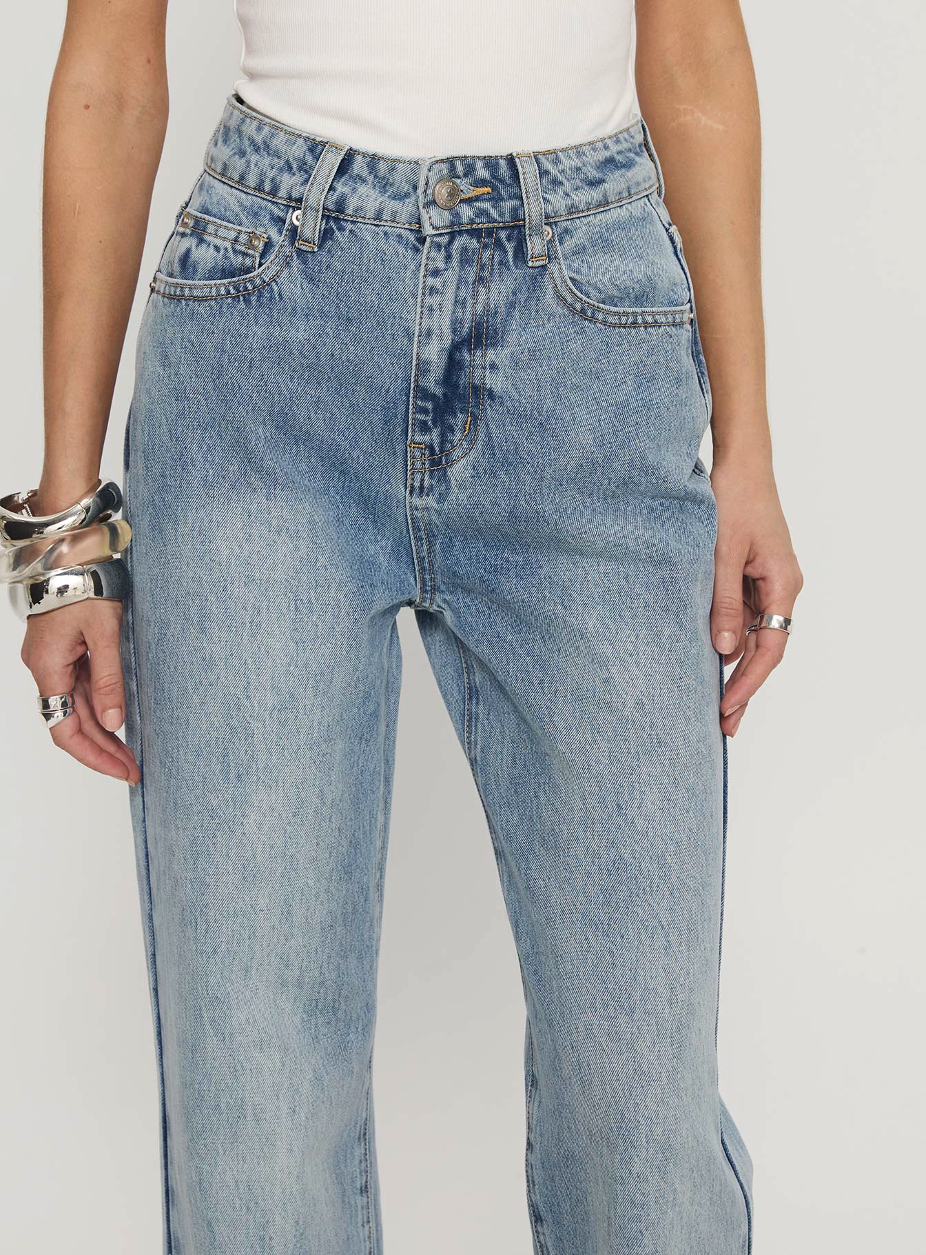 front view of model wearing Princess Polly Florida Keys Mid Rise Straight Leg Cuffed Jeans Light Blue Wash High Waisted Jeans 