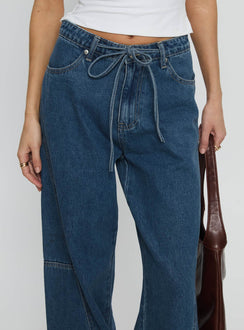 front view of model wearing Princess Polly Bruiser Mid Rise Wide Leg Jeans Mid Blue Wash Mid Rise Jeans 