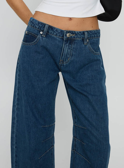 side view of model wearing Princess Polly Lost Track Mid Rise Barrel Leg Jeans Mid Wash Mid Rise Jeans 