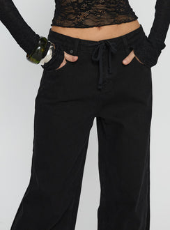 back view of model wearing Princess Polly Mellowed Out Low Rise Straight Leg Jeans Washed Black Low Rise Jeans 