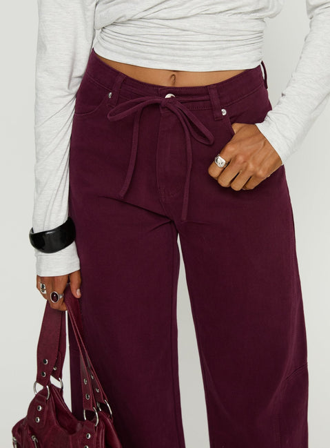 back view of model wearing Princess Polly Bruiser Tie Waist Mid Rise Wide Leg Jeans Currant High Rise Jeans Jeans 