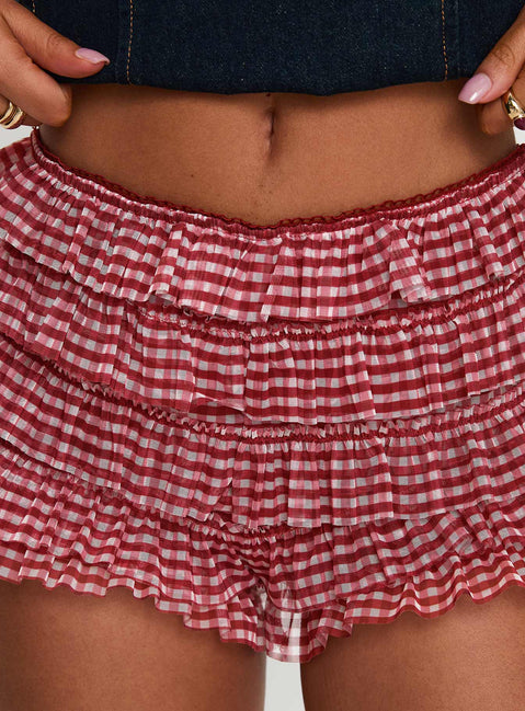 side view of model wearing Princess Polly Biscotti Low Rise Bloomer Shorts Red Gingham High Waisted Shorts 
