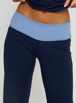 back view of model wearing Princess Polly Kobee Jersey Flare Pants Navy / Light Blue High Rise Pants 