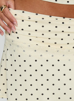 back view of model wearing Princess Polly Amia Lace Mini Skirt Cream Polka Dot Mini Skirts Skirts 