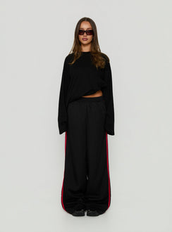 Presenting Fielder Track Pants Black / Red in womens-regular-pants with mid-rise on-body view of model wearing