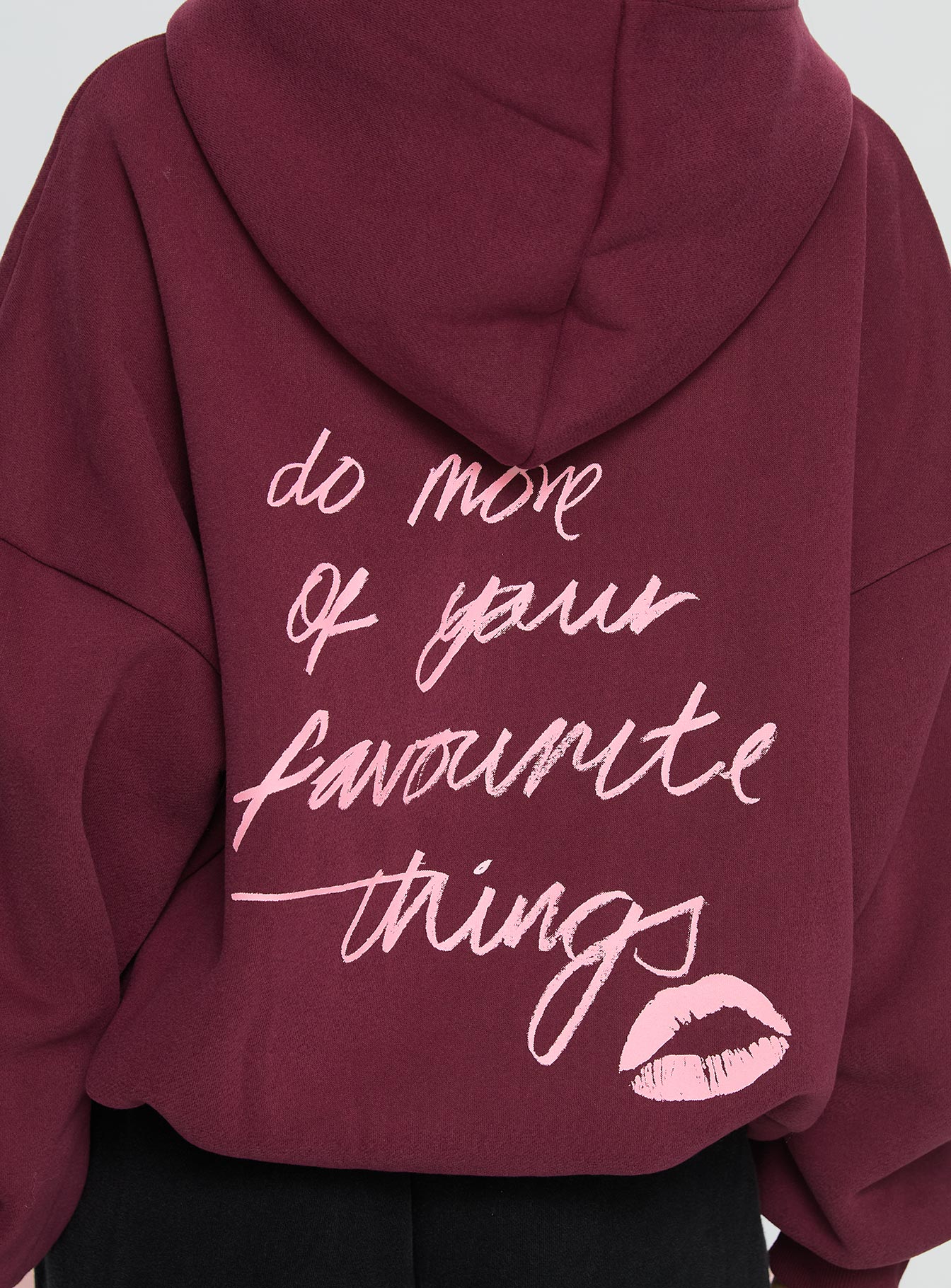 side view of model wearing Princess Polly Kisses Graphic Hoodie Wine Longline Jumpers 